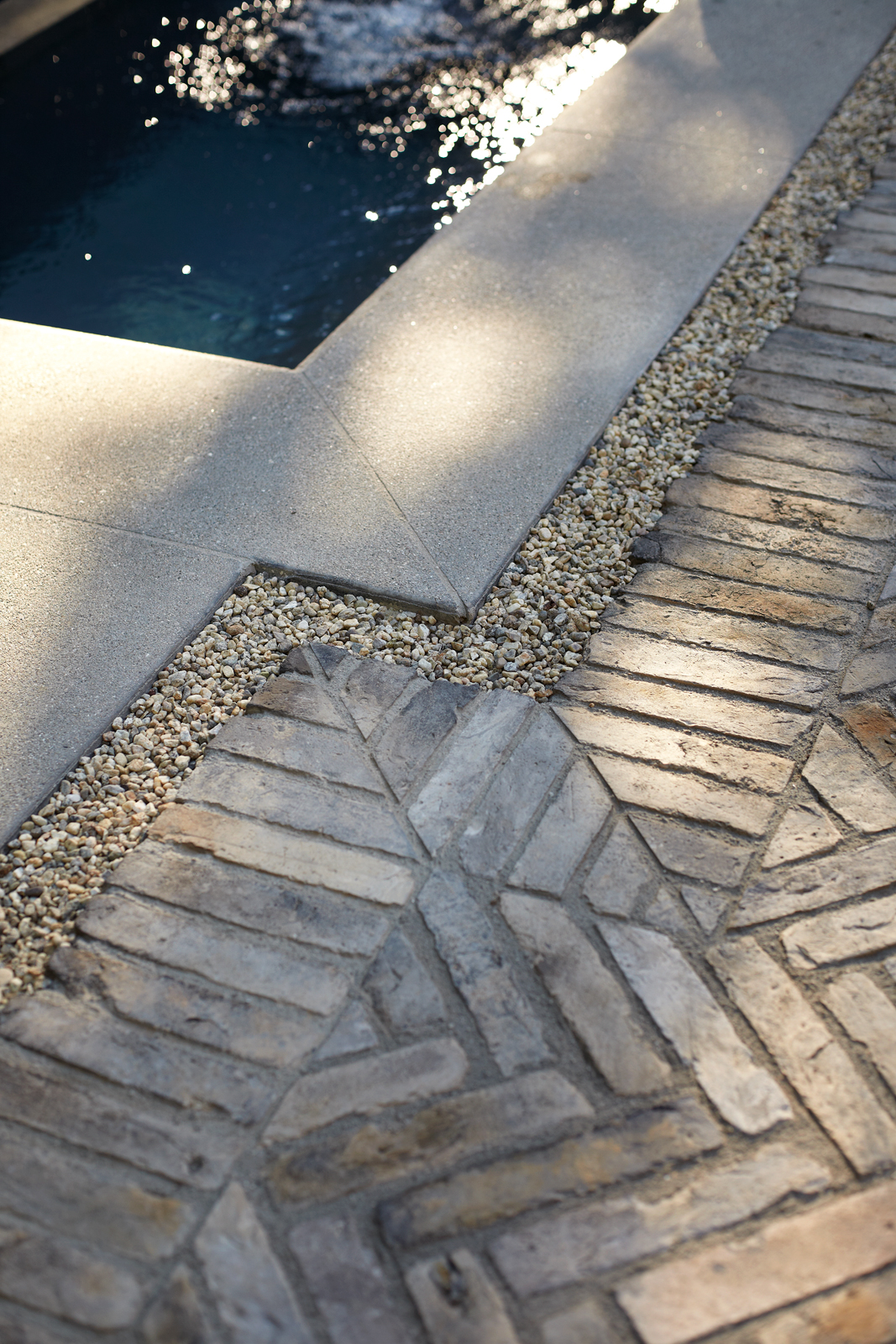 herringbone-brick-pavers-gravel-drainage-pools-gardenista