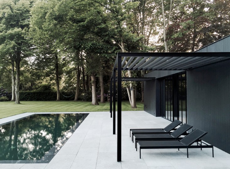 COPP_POOLHOUSE_Merckx_black_steel_pergola_chaise_loungers_patio_terrace_Gardenista